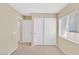 Neutral bedroom features a closet and a window, allowing ample natural light at 7920 Turtle Island Ct, Las Vegas, NV 89129