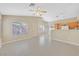 Bright, open living space featuring tile flooring, neutral walls, and seamless flow to the kitchen at 7920 Turtle Island Ct, Las Vegas, NV 89129