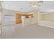 Open-concept living space with tile floors connects to the kitchen with bright, neutral walls at 7920 Turtle Island Ct, Las Vegas, NV 89129