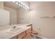 Bright bathroom featuring vanity with ample counter space, single sink, and large mirror at 801 Dana Hills Ct # 101, Las Vegas, NV 89134