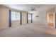 Large bedroom with natural light, a ceiling fan, plush carpet, and access to additional rooms at 801 Dana Hills Ct # 101, Las Vegas, NV 89134
