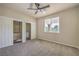 Bright bedroom with a ceiling fan, closet with shelving, and a window with natural light at 801 Dana Hills Ct # 101, Las Vegas, NV 89134