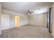 Spacious bedroom with neutral walls, carpet flooring, ceiling fan, and natural light from the window at 801 Dana Hills Ct # 101, Las Vegas, NV 89134