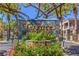 The Terraces on the Green community entrance has lush landscaping and a gate at 801 Dana Hills Ct # 101, Las Vegas, NV 89134