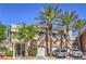 Charming townhome exterior with manicured landscaping, shade trees, and two-car garage at 801 Dana Hills Ct # 101, Las Vegas, NV 89134