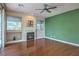 Spacious living room features hardwood floors, fireplace, and large windows at 801 Dana Hills Ct # 101, Las Vegas, NV 89134