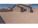 View of backyard with partial block wall and sliding door to the house at 817 Cottonwood Hill Pl, Henderson, NV 89011