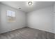 Neutral bedroom with gray carpet, a window with blinds, and ample natural light at 817 Cottonwood Hill Pl, Henderson, NV 89011