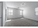 Bright, spacious bedroom with plush carpet flooring, neutral paint, and natural light from two windows at 817 Cottonwood Hill Pl, Henderson, NV 89011