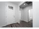 A well-lit entryway boasts a modern front door and stylish hardwood flooring at 817 Cottonwood Hill Pl, Henderson, NV 89011