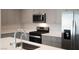 Modern kitchen featuring stainless steel appliances, gray cabinets, and an island at 817 Cottonwood Hill Pl, Henderson, NV 89011