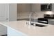 Modern kitchen featuring stainless steel appliances, gray cabinets, and an island at 817 Cottonwood Hill Pl, Henderson, NV 89011