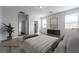 A well-lit main bedroom features a neutral color palette and plush carpeting at 817 Cottonwood Hill Pl, Henderson, NV 89011