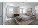 Virtually staged main bedroom features neutral tones, plush carpet, and stylish decor at 817 Cottonwood Hill Pl, Henderson, NV 89011