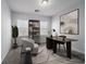 Well lit office space, decorated with dark wood desk, bookcase, chair, and neutral decor at 817 Cottonwood Hill Pl, Henderson, NV 89011