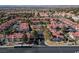 Aerial view of a well-maintained community with pool, landscaping, and residential buildings at 8455 W Sahara Ave # 289, Las Vegas, NV 89117