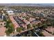 A beautiful aerial view of a Las Vegas, Nevada neighborhood with multiple apartment buildings with a pool and surrounding trees at 8455 W Sahara Ave # 289, Las Vegas, NV 89117