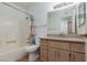 Bathroom with granite vanity, tile flooring, and tub with shower at 8455 W Sahara Ave # 289, Las Vegas, NV 89117