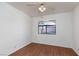 Bright bedroom features wood floors, a ceiling fan, and a window with neighborhood views at 8455 W Sahara Ave # 289, Las Vegas, NV 89117