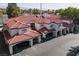 Stylish condo with covered parking, red tile roof, and charming architectural details at 8455 W Sahara Ave # 289, Las Vegas, NV 89117
