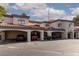Beautiful townhome featuring assigned covered parking, stairs, and tile roofing at 8455 W Sahara Ave # 289, Las Vegas, NV 89117