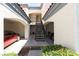 Charming townhouse featuring assigned covered parking, stairs, and mature landscaping at 8455 W Sahara Ave # 289, Las Vegas, NV 89117