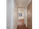Hallway leading to a bedroom with a ceiling fan and window at 8455 W Sahara Ave # 289, Las Vegas, NV 89117