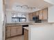 Well-lit kitchen with updated stainless steel appliances, granite countertops, and tiled floor at 8455 W Sahara Ave # 289, Las Vegas, NV 89117