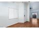 Bright living room with wood floors, white walls, and sliding glass doors at 8455 W Sahara Ave # 289, Las Vegas, NV 89117