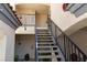 Shared stairwell featuring a metal railing system providing access to units above garages at 8455 W Sahara Ave # 289, Las Vegas, NV 89117