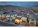 Aerial view of a community neighborhood with a well-maintained home boasting a tile roof and manicured landscaping at 8984 Rolling Pietra St, Las Vegas, NV 89166