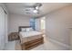 Comfortable bedroom with a ceiling fan and view into the ensuite bathroom at 8984 Rolling Pietra St, Las Vegas, NV 89166