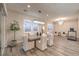 Bright dining area features wood floors and modern lighting fixtures at 8984 Rolling Pietra St, Las Vegas, NV 89166