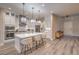 Stylish kitchen with hardwood floors, recessed lighting, a center island with seating, and modern appliances at 8984 Rolling Pietra St, Las Vegas, NV 89166