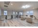 Open loft area with modern lighting, glass railing, and neutral decor at 8984 Rolling Pietra St, Las Vegas, NV 89166