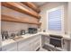 Home office featuring custom shelves, cabinets, and a built-in desk at 8984 Rolling Pietra St, Las Vegas, NV 89166