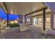 Outdoor patio showcasing paved flooring, covered structure, and a stone-clad island with a built-in cooktop at 8984 Rolling Pietra St, Las Vegas, NV 89166