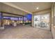 Inviting covered patio with stone flooring, outdoor seating, and seamless indoor-outdoor flow at 8984 Rolling Pietra St, Las Vegas, NV 89166