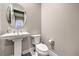 Clean powder room with a pedestal sink and modern fixtures at 8984 Rolling Pietra St, Las Vegas, NV 89166