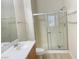 Bathroom with single sink vanity and enclosed shower featuring glass doors at 8985 S Durango Dr # 2043, Las Vegas, NV 89113