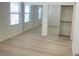 Bedroom with mirrored closet doors and modern flooring at 8985 S Durango Dr # 2043, Las Vegas, NV 89113