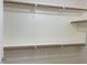 Spacious walk-in closet with wood shelving at 8985 S Durango Dr # 2043, Las Vegas, NV 89113