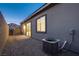 Low maintenance backyard with gravel, patio, and block fence, offering privacy and space at 909 Allister Fields Ln, Las Vegas, NV 89138