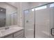 Sleek bathroom featuring a glass-enclosed shower, modern fixtures, and ample lighting at 909 Allister Fields Ln, Las Vegas, NV 89138