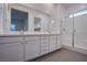 Modern bathroom showcasing dual sinks, a spacious shower, and contemporary design at 909 Allister Fields Ln, Las Vegas, NV 89138