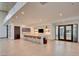 Spacious common area features a long island with bar seating, perfect for gatherings and entertaining at 909 Allister Fields Ln, Las Vegas, NV 89138
