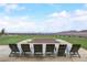 Outdoor fire pit with seating, perfect for entertaining and enjoying the views at 909 Allister Fields Ln, Las Vegas, NV 89138