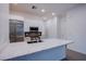 Modern kitchen boasts white cabinetry, stainless steel appliances, and a spacious island perfect for entertaining at 909 Allister Fields Ln, Las Vegas, NV 89138
