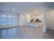 Open-concept living room boasts modern tile flooring, recessed lighting, and natural light at 909 Allister Fields Ln, Las Vegas, NV 89138