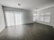 Bright living space offers a sliding door and ample sunlight, highlighting the modern tile floors at 909 Allister Fields Ln, Las Vegas, NV 89138